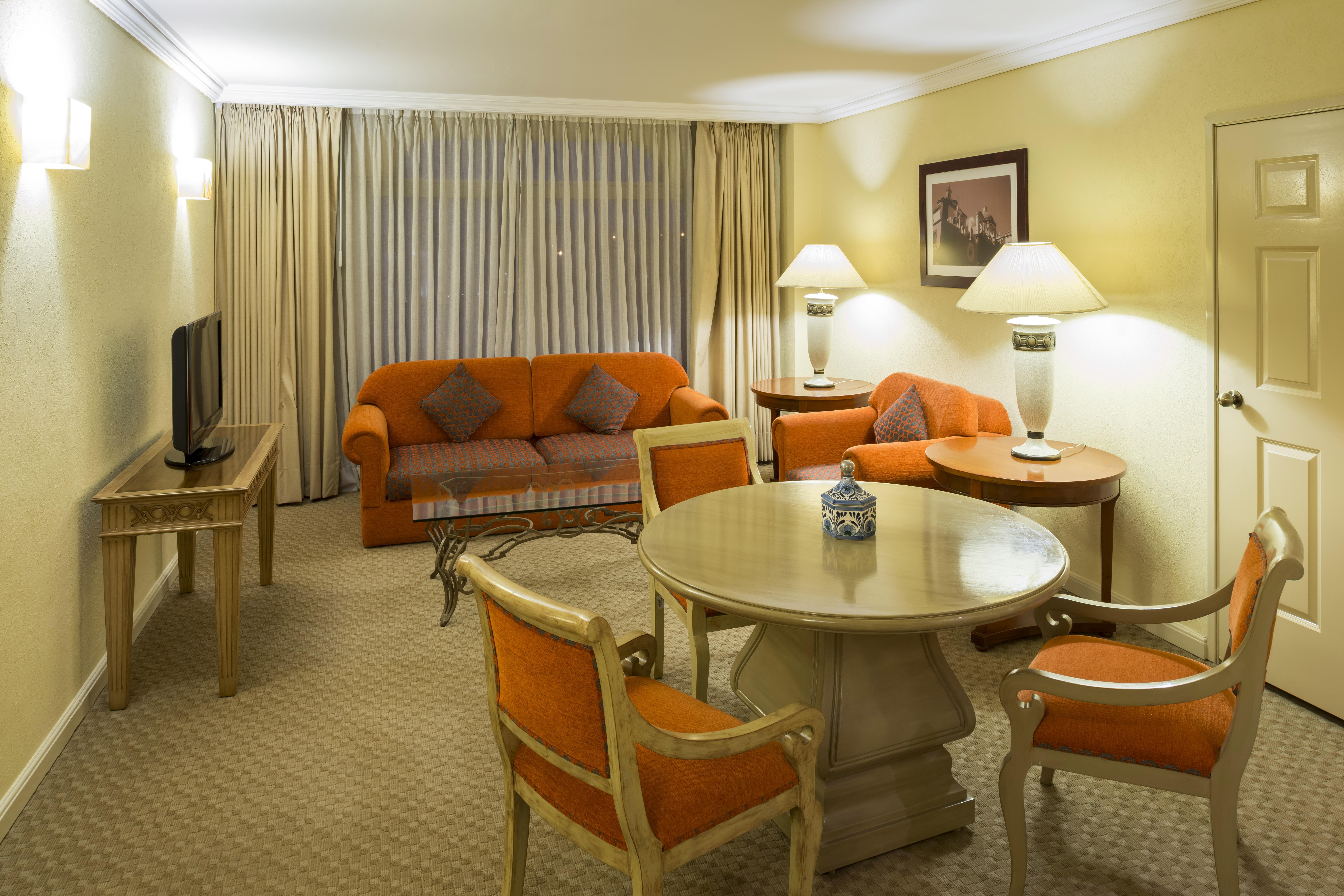 Camino Real Puebla Angelopolis Hotel Exterior photo A living room in a suite
